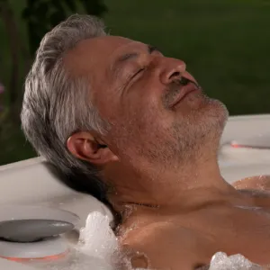 Man Soaking in Hot Tub